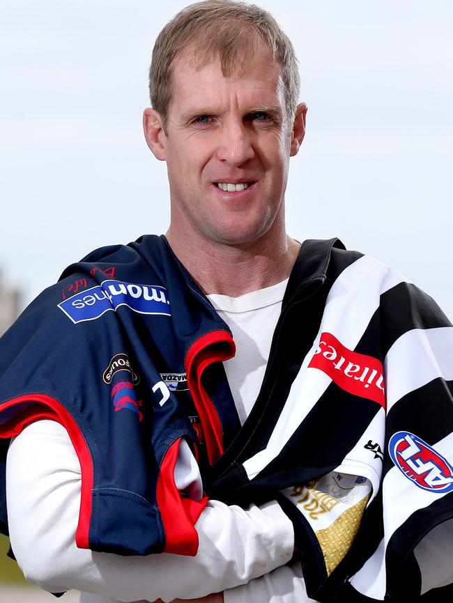 Stephen Patterson with the Norwood and Collingwood guernseys he wore during a distinguished SANFL and AFL career. Picture: Calum Robertson