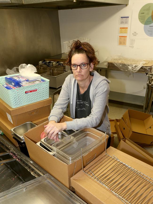 Ms Teaki Page packs up her store. Picture Mike Batterham