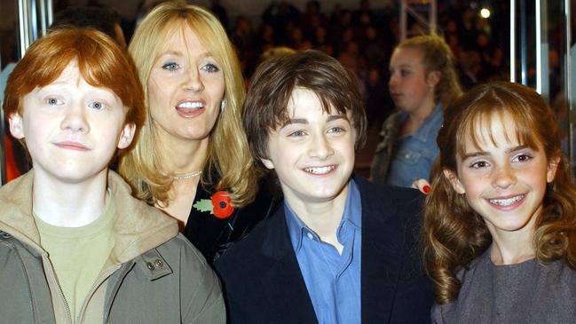 Author JK Rowling (second from left) with the stars of the movie version of Harry Potter and the Philosopher’s Stone (from left) Rupert Grint, Daniel Radcliffe and Emma Watson in London in 2001. Picture: AP