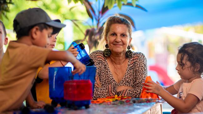 Irene Billias has been named the NT's favourite childcare educator. She is joined here by Arjun Pushpala, Costa Billias, Marianthi Kotis, and Sevasti Skartados. Picture: Che Chorley