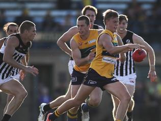 14/5/16 SANFL: Nicholas Hayse and Marc Borholm (shepherding) of the Eagles break away from Tom Clureyl of Port. Eagles v Port Adelaide at Woodville Oval. Picture by Matt Turner.