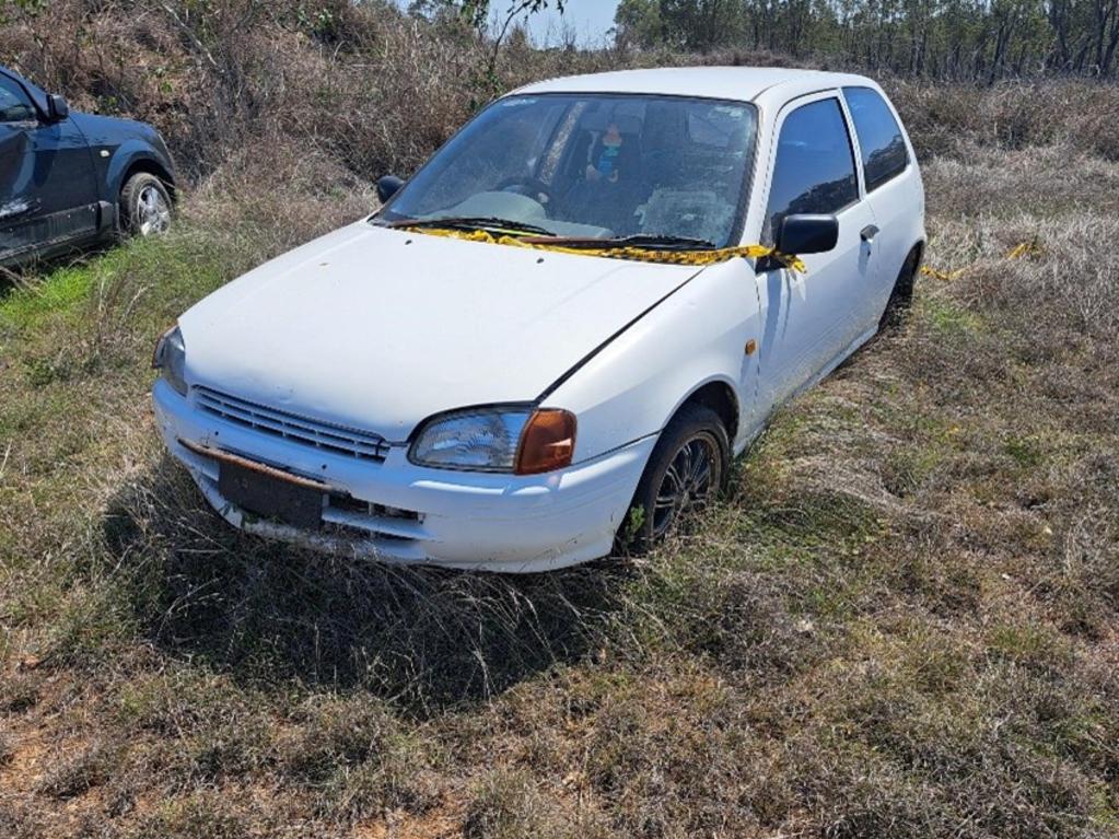 Unregistered, white, three door hatchback Toyota Starlet.