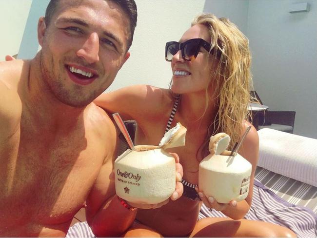 Sam and Phoebe Burgess enjoy coconut milk while on "babymoon". Phoebe’s cute little baby bump is on display. Picture: Instagram