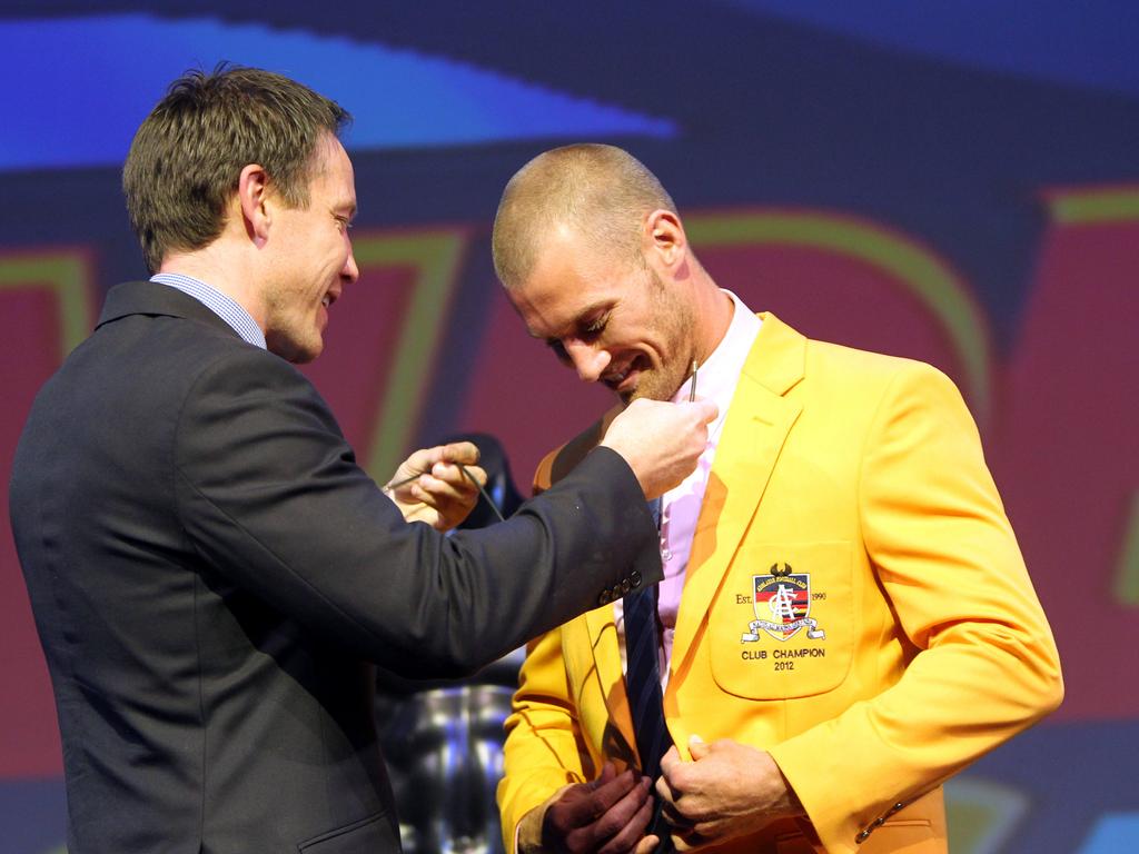 2012 -  Thommo liked the colour so much he decided to win another gold jacket. Coach Brenton Sanderson presents the club champion with the Malcolm Blight Medal at the Adelaide Convention Centre.