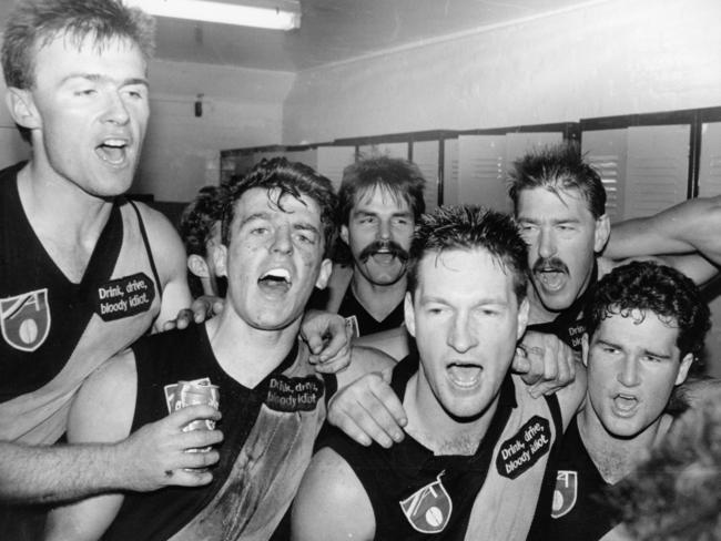 Richmond players celebrate after a win in 1990. But there wasn’t much to celebrate about financially down at Tigerland. Picture: George Salpigtidisy