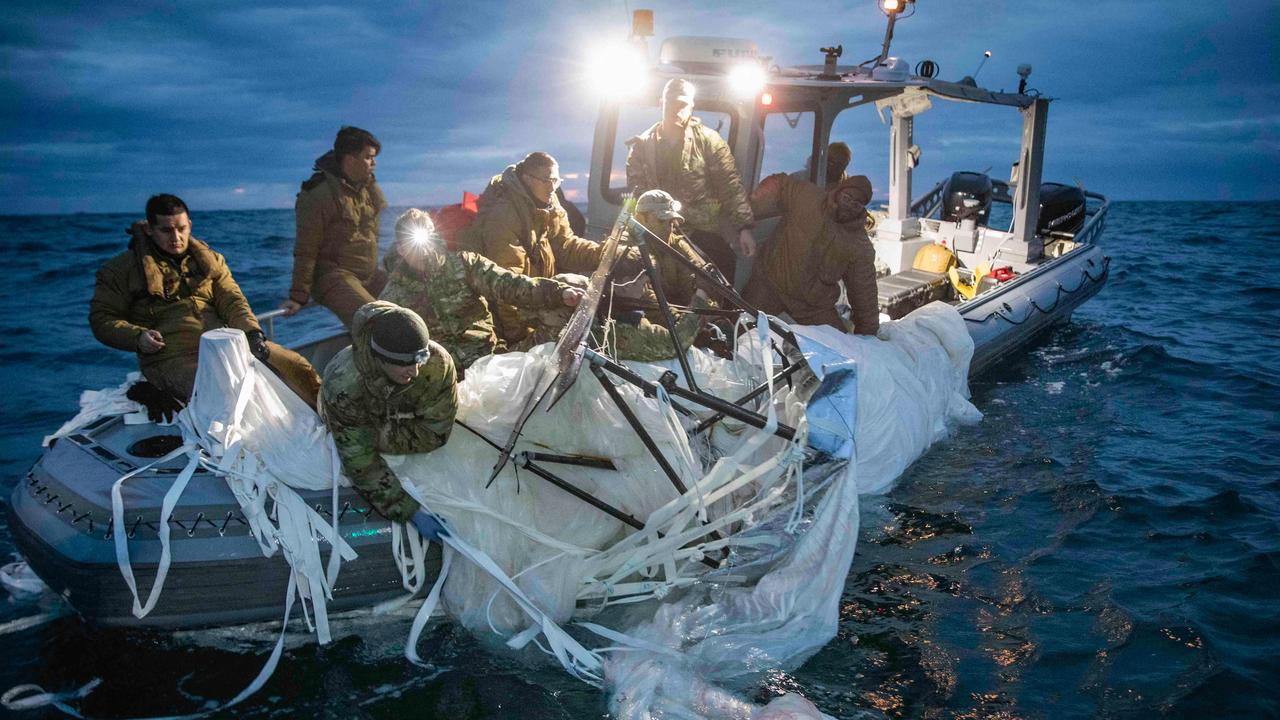 US Navy sailors recover a high-altitude surveillance balloon off the coast of Myrtle Beach, South Carolina, in the Atlantic ocean on February 5. Picture: US NAVY / AFP