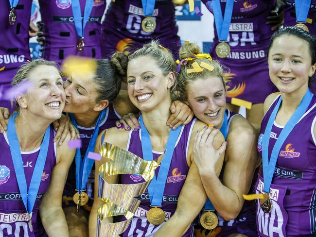 Laura Geitz celebrates with her Firebirds team mates after winning the grand final match against the NSW Swifts in Brisbane, on July 31, 2016. Picture: AAP