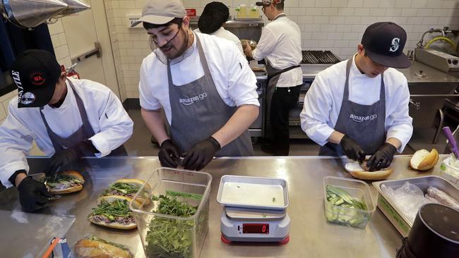 Workers make sandwiches at the Amazon Go store. Picture: AP.