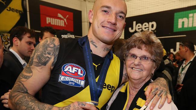 2019 AFL Grand Final. 28/09/2019.  Richmonds Dustin Martin  with his grandmother DLois Knight in the rooms after the 2019 AFL Grand Final match between the Richmond Tigers and the GWS Giants at the MCG on September 28, 2019 in Melbourne, Australia. Picture: Michael Klein.