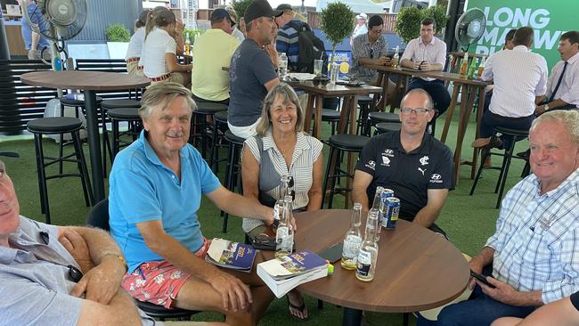 Melbourne Cup winners John Symons (left) and Sheila Laxon (middle) celebrate with a drink after purchasing Knight’s Choice from Norm Bazeley (far right) at the Magic Millions sale. Picture: Supplied