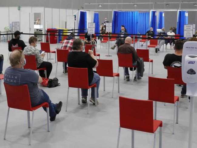 People wait to be vaccinated inside the centre. Monday, May 3, 2021. Picture: David Crosling