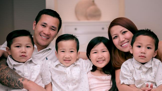 Tony Hoang with his wife and four children. He also has two other children who he has adopted.