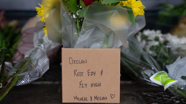 The Darwin community is paying its respects to 20-year-old bottleshop worker Declan Laverty after he was stabbed to death about 9pm Sunday, March 19. Several have left heartfelt messages alongside floral arrangements. Picture: Pema Tamang Pakhrin