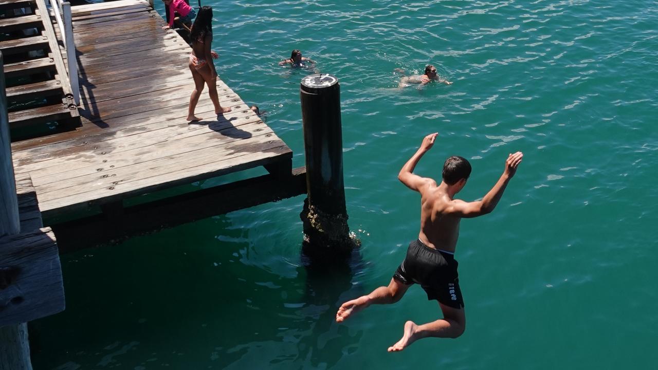 Jaden Coombes from Arrawarra takes the plunge. Picture: Chris Knight