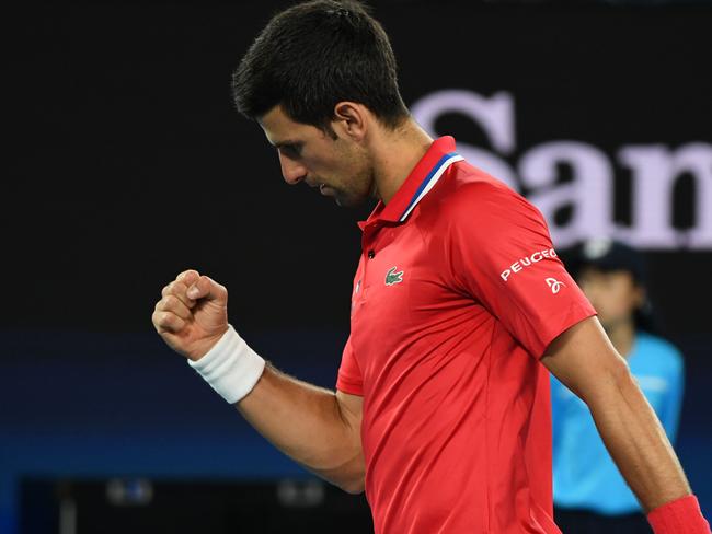 Serbia's Novak Djokovic reacts as he and partner Nikola Cacic play against Germany's Jan-Lennard Struff and Alexander Zverev during their ATP Cup group A men's doubles tennis match in Melbourne on February 5, 2021. (Photo by Paul CROCK / AFP) / -- IMAGE RESTRICTED TO EDITORIAL USE - STRICTLY NO COMMERCIAL USE --