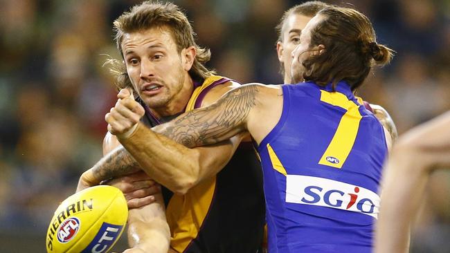 Ivan Maric clears under pressure during the Round 12 match against West Coast Eagles. Picture: Michael Klein.