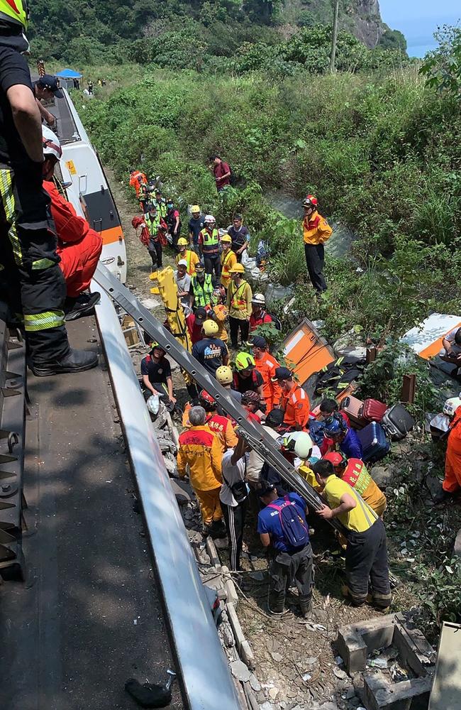 The train was carrying about 350 passengers with some having escaped through windows to safety. Picture: Taiwan Red Cross/ AFP