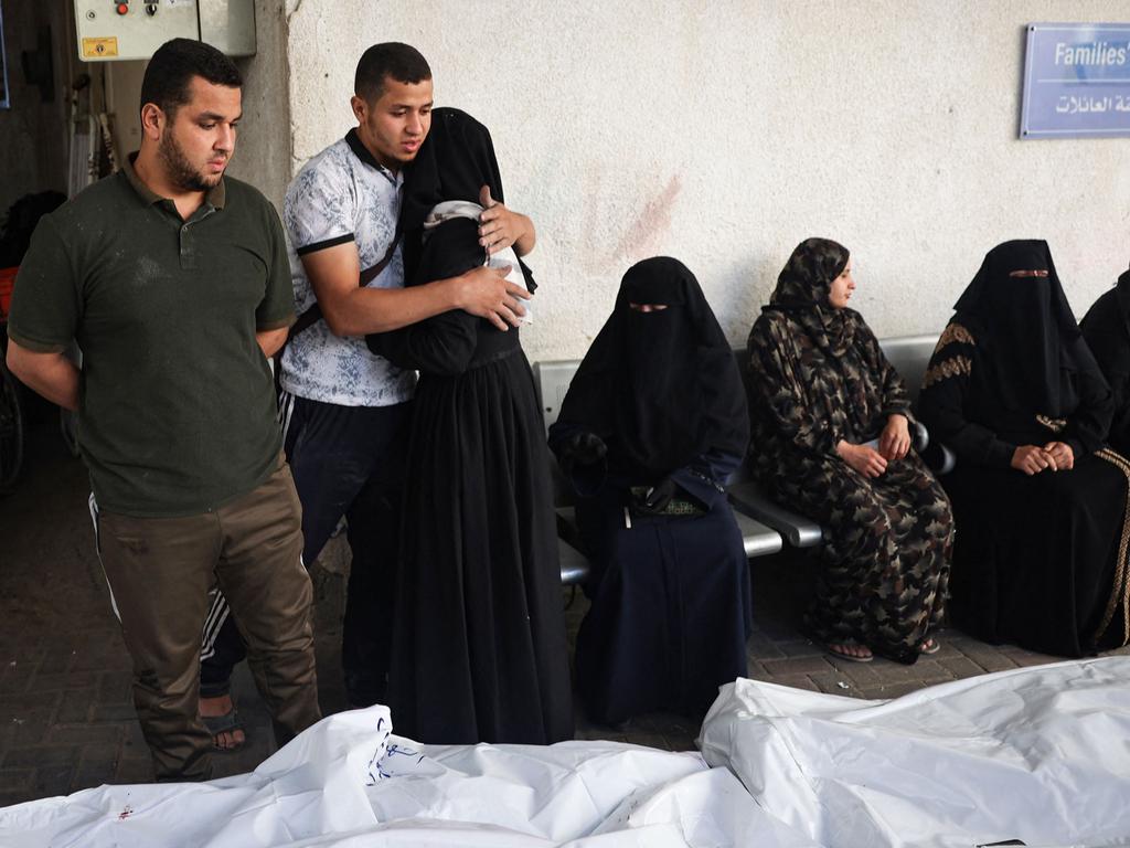 Relatives of Palestinians killed in Israeli bombing, mourn near their corpses in the yard of the al-Najjar hospital in Rafah in the southern Gaza Strip. Picture: AFP