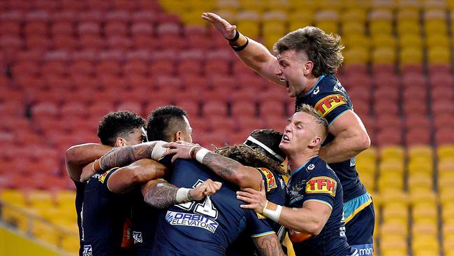 Titans players react after Phillip Sami scored the winning try. Picture: AAP Image/Dan Peled