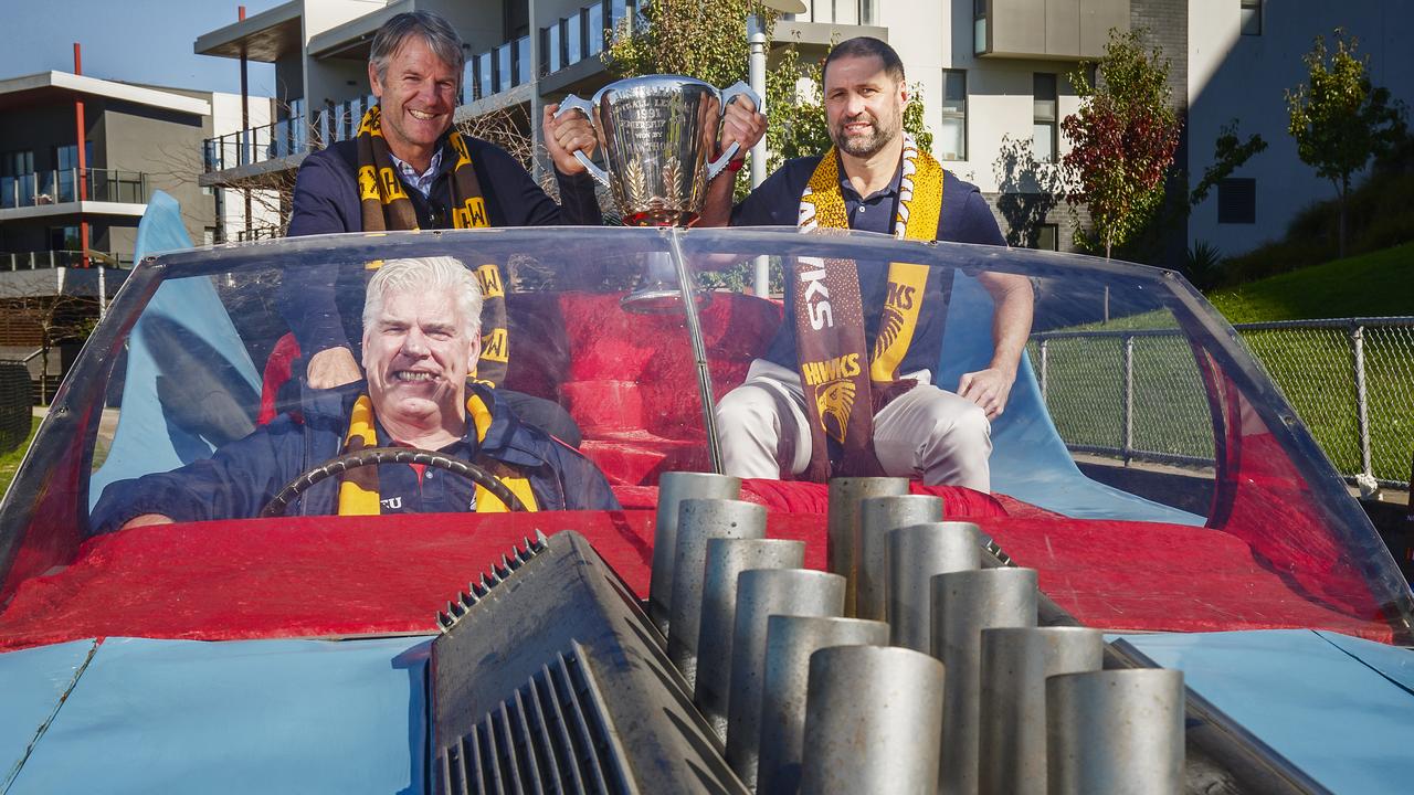 Hawks legends Gary Ayres, Darrin Pritchard (top right) and Andrew Gowers (top left) in the famous ‘Batmobile’ from the 1991 AFL Grand Final ceremony.