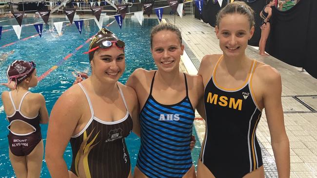 All Hallows' School swimmer Elizabeth Dekkers flanked by fellow podium finishers at the CaSSSA swimming carnival.