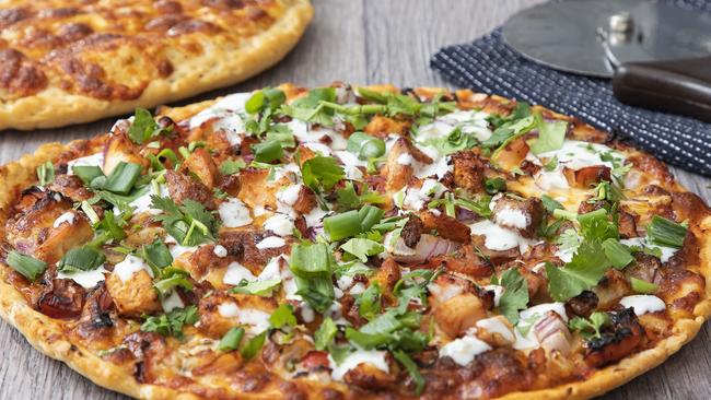 Upper Coomera Best Bite Pizza's butter chicken pizza captures the takeaway shop's Indian-influenced pizza options. 