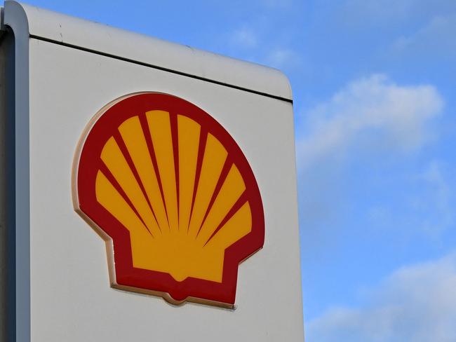 A Shell logo is pictured on a sign outside a Royal Dutch Shell petrol station in Gateshead, north east England on January 31, 2023. - Shell stated earlier this month that windfall taxes imposed by the European Union and UK following the surge in profits would cost the group about $2 billion. Shell unveils its annual results on February 2, 2023. (Photo by Paul ELLIS / AFP)