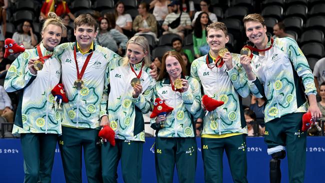 Australia’s triumphant 34-point mixed 4x100m medley relay squad with their gold medals. Picture: PA