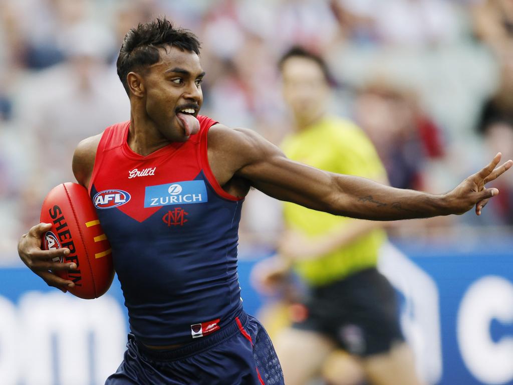 Kysaiah Pickett of the Demons looks back at Joshua Draper and gives him the peace sign as he run into an open goal. Picture: Michael Klein