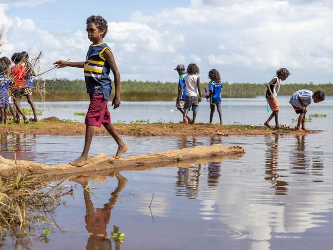 Gapuwiyak children play by Lake Evella, which sits on the edge of the community, in northeast Arnhem Land. Picture: Floss Adams