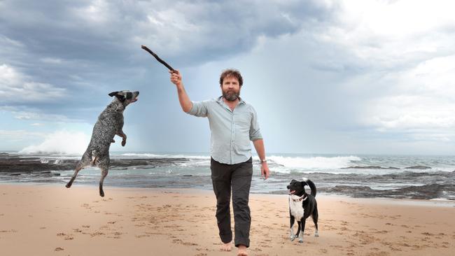 Renewable electricity advocate Saul Griffith with his dogs Radar and Loki at Austinmer Beach near Wollongong. Picture: Jane Dempster