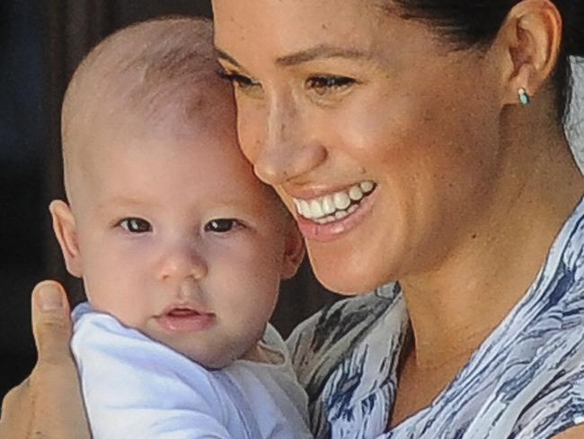 (FILES) In this file photo  Meghan, Duchess of Sussex holds her baby son Archie as she and Britain's Prince Harry, Duke of Sussex meet Archbishop Desmond Tutu and his wife Leah at the Tutu foundation in Cape Town on September 25, 2019. - Prince Harry and Meghan Markle announced on June 6, 2021 the birth of their daughter Lilibet Diana, who was born in California after a year of turmoil in Britain's royal family. "Lili is named after her great-grandmother, Her Majesty The Queen, whose family nickname is Lilibet. Her middle name, Diana, was chosen to honor her beloved late grandmother, The Princess of Wales," said a statement from the couple. (Photo by HENK KRUGER / POOL / AFP)