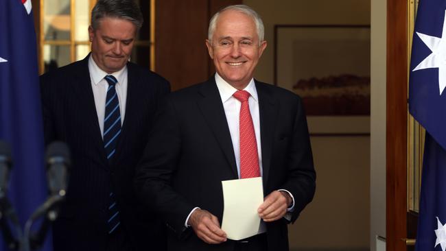 Prime Minister Malcolm Turnbull was all smiles yesterday when he spoke about the postal vote result with Senator Mathias Cormann at Parliament House in Canberra. Picture: Gary Ramage