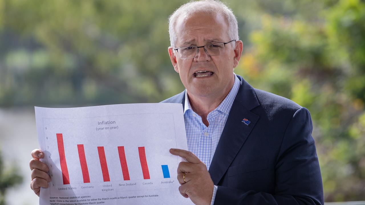 Prime Minister Scott Morrison notes inflation in Australia is lower than in other countries including the US, at a Rockhampton cafe. Picture: Jason Edwards