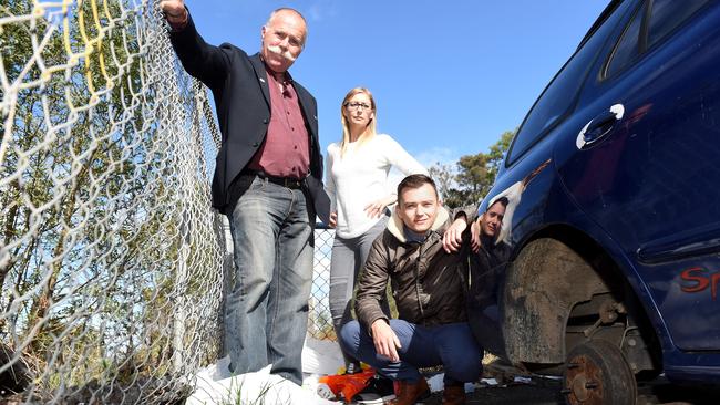 Hume councillors Jack Medcraft, Jodi Jackson and Naim Kurt among the rubbish and a dumped car at Broadmeadows train station. Picture: Kylie Else