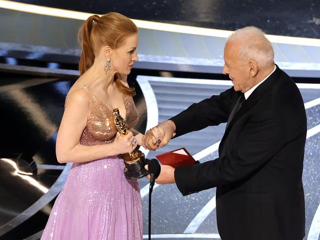 Jessica Chastain accepted her Oscar from Anthony Hopkins. Picture: AFP