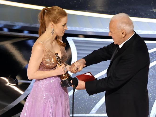 Jessica Chastain accepted her Oscar from Anthony Hopkins. Picture: AFP