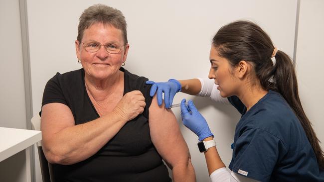 Jill Kennett receives her first Covid vaccine from registered nurse Rayane Tristao at the Health Hub in Morayfield. Picture: Brad Fleet