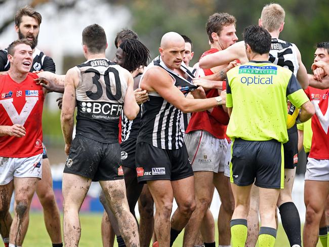 29/06/19 - SANFL: North Adelaide v Port Adelaide at Prospect Oval.  Players tussle at half time. Picture: Tom Huntley