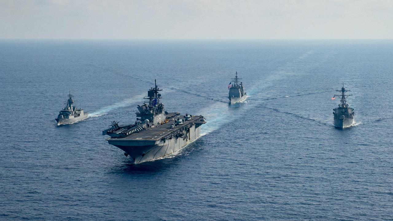 Royal Australian Navy helicopter frigate HMAS Parramatta conducts officer of the watch manoeuvres with amphibious assault ship USS America, guided-missile cruiser USS Bunker Hill and guided-missile destroyer USS Barry in the South China Sea. Picture: Defence