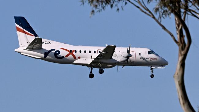 A Rex Airlines Saab 340B prepares to land at Melbourne's Tullamarine Airport on July 30, 2024 after the Australian regional airline announced a trading halt and thus fuelling speculations of financial challenges. (Photo by William WEST / AFP)