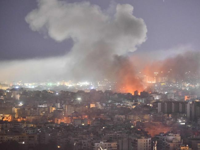 TOPSHOT - Smoke rises from the site of an Israeli airstrike that targeted a neighborhood in Beirutâs southern suburb on October 3, 2024. The Israeli military issued orders in the early hours of October 3, telling people to leave multiple areas of densely-populated southern Beirut, where it says it will hit Hezbollah sites. "You are located near facilities and interests belonging to Hezbollah, which the army will act against in the near future," Israeli military spokesman Avichay Adraee said in a post on social media site X, naming the Haret Hreik, Burj al-Barajneh and Hadath Gharb areas. (Photo by Fadel ITANI / AFP)