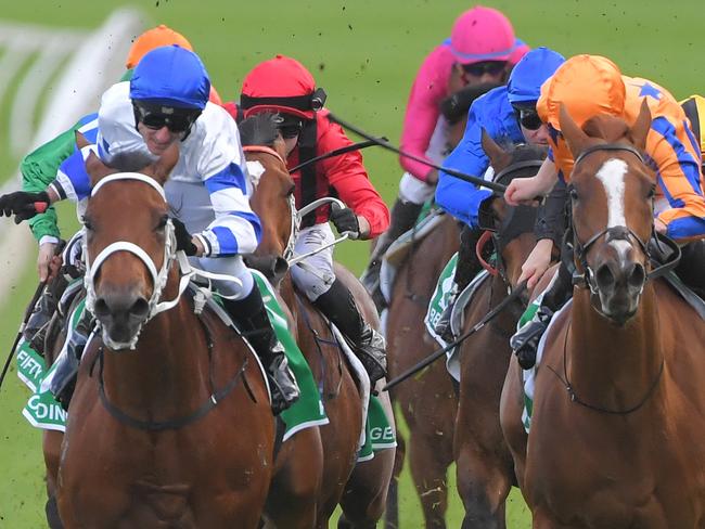 Glen Boss (left) rides Kolding to victory in the TAB Epsom.