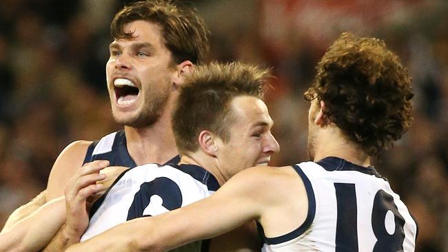 Geelong's Lincoln McCarthy, Tom Hawkins and Josh Cowan celebrate Geelong’s win. Picture: George Salpigtidis