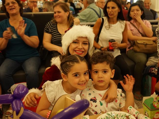 Families packed Bankstown Central to welcome Santa and his elves.