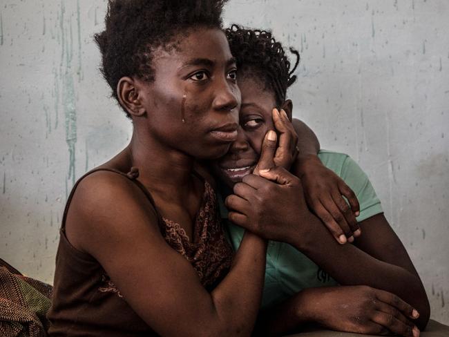 Contemporary Issues - Third Prize, Singles © Daniel Etter Title: The Libyan Migrant Trap Two Nigerian refugees cry and embrace in a detention center for refugees in Surman, Libya, on 17 August 2016. The detention center houses hundreds of women escaping precarious conditions. Many claim they are regularly beaten or sexually assaulted, and receive insufficient amounts of food and water at the center. Most of these women were attempting to reach Europe by being smuggled across the Mediterranean in boats setting sail from neighboring Sabratah.