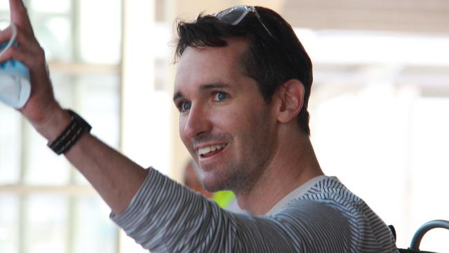 Journalist Bill Birtles waving as he arrives in Sydney after leaving China over arrest fears. Picture: Supplied-