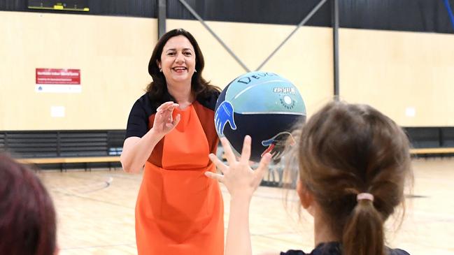 Queensland Premier Annastacia Palaszczuk passes a basketball with young players as she officially opens the Northside Indoor Sports Centre in Zillmere. Picture: NCA NewsWire / Dan Peled