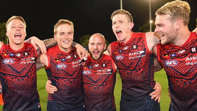 Demons James Harmes, Bernie Vince, Nathan Jones, Sam Frost and Jack Watts sing the song after a win in 2017. Picture: Quinn Rooney/Getty Images