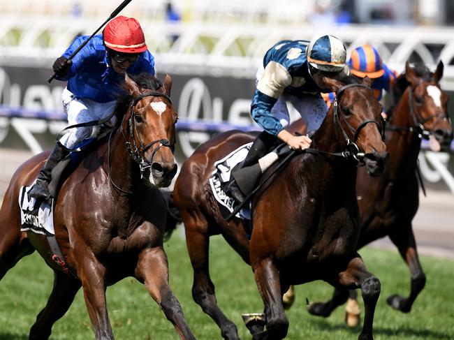 Jockey Kerrin McEvoy  (centre) celebrates as he rides Cross Counter to victory in race 7 the Lexus Melbourne Cup, as part of the Melbourne Cup Carnival, at Flemington Racecourse in Melbourne, Tuesday, November 6, 2018. (AAP Image/Dan Himbrechts) NO ARCHIVING, EDITORIAL USE ONLY